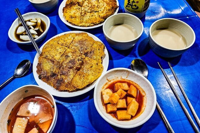 Busan: Food Crawl with Fish Market, Soju Tents & Local Snacks - Bupyeong Kkangtong Market: noodles, street bites, and a real backstory