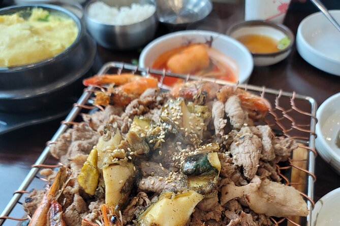 Full Day Private Seoul Tour for foodies - Bukchon Hanok Village: traditional houses, short stop, good photos