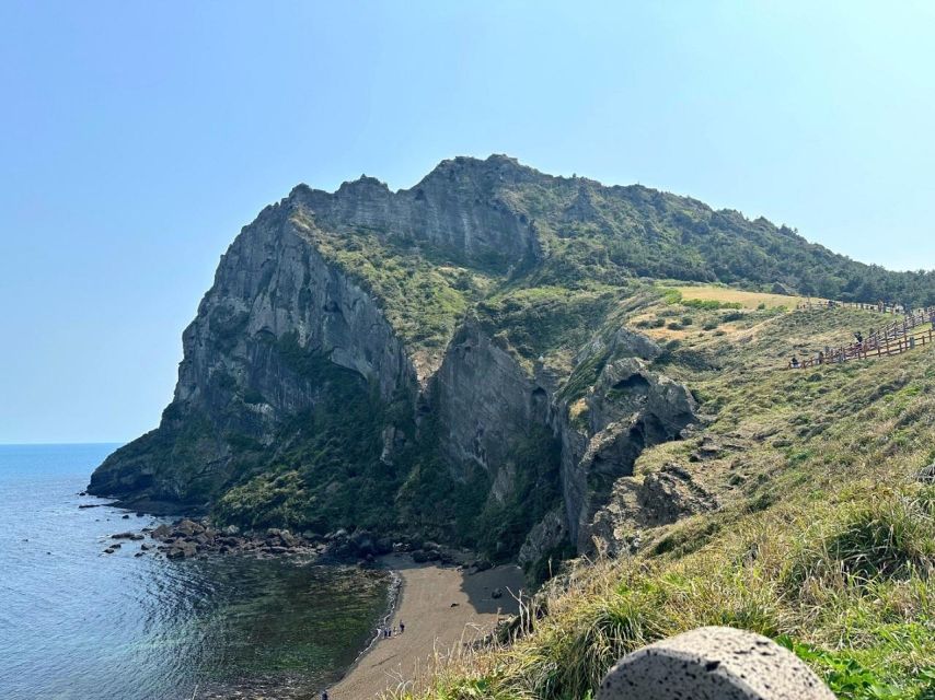 Jeju: East Tour with Sunrise Peak, Seongeup & Coastal Views - Seopjikoji Cliffs: Lighthouse Views and Drama by the Sea