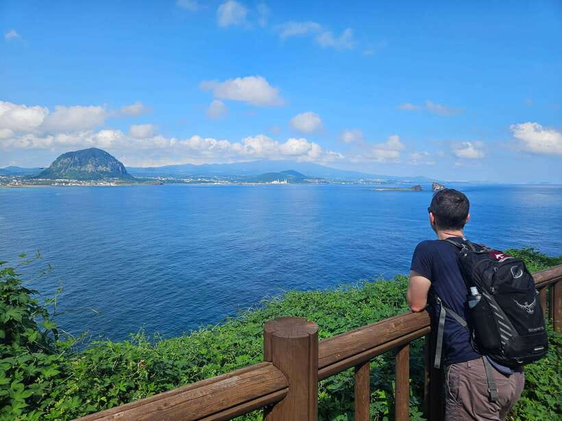 Jeju Island: Full-Day SouthWest Bus Tour with Entry Fees - Songaksan: coastal trails with a big-sky payoff
