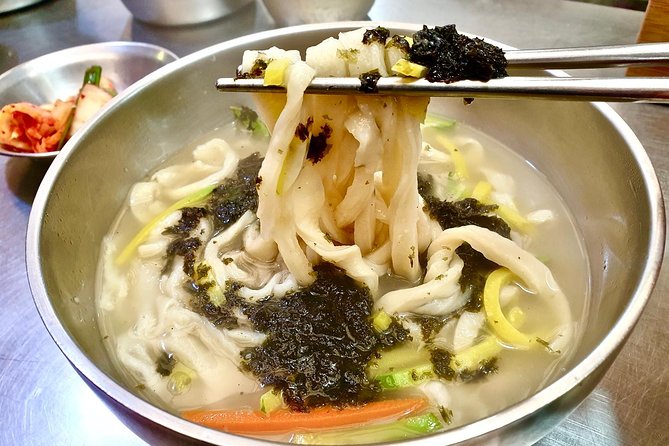 Private Downtown Seoul Food & Market Tour with 8+ Tastings - The traditional hilltop village stop, where snacks fit between hanok streets
