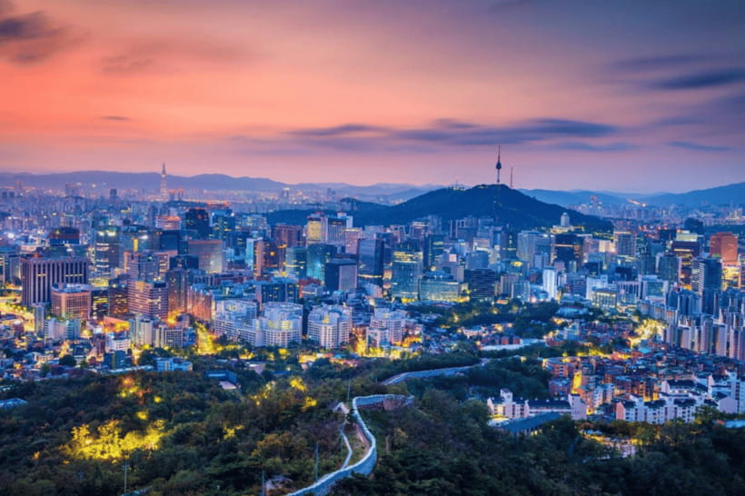 Seoul at dusk with Namsan and the N Seoul Tower above the rooftops